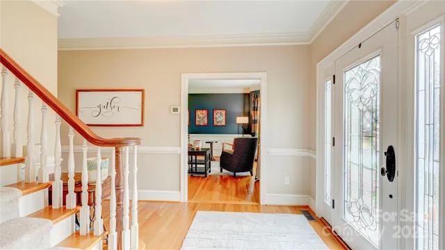 a view of a hallway with paintings on the walls