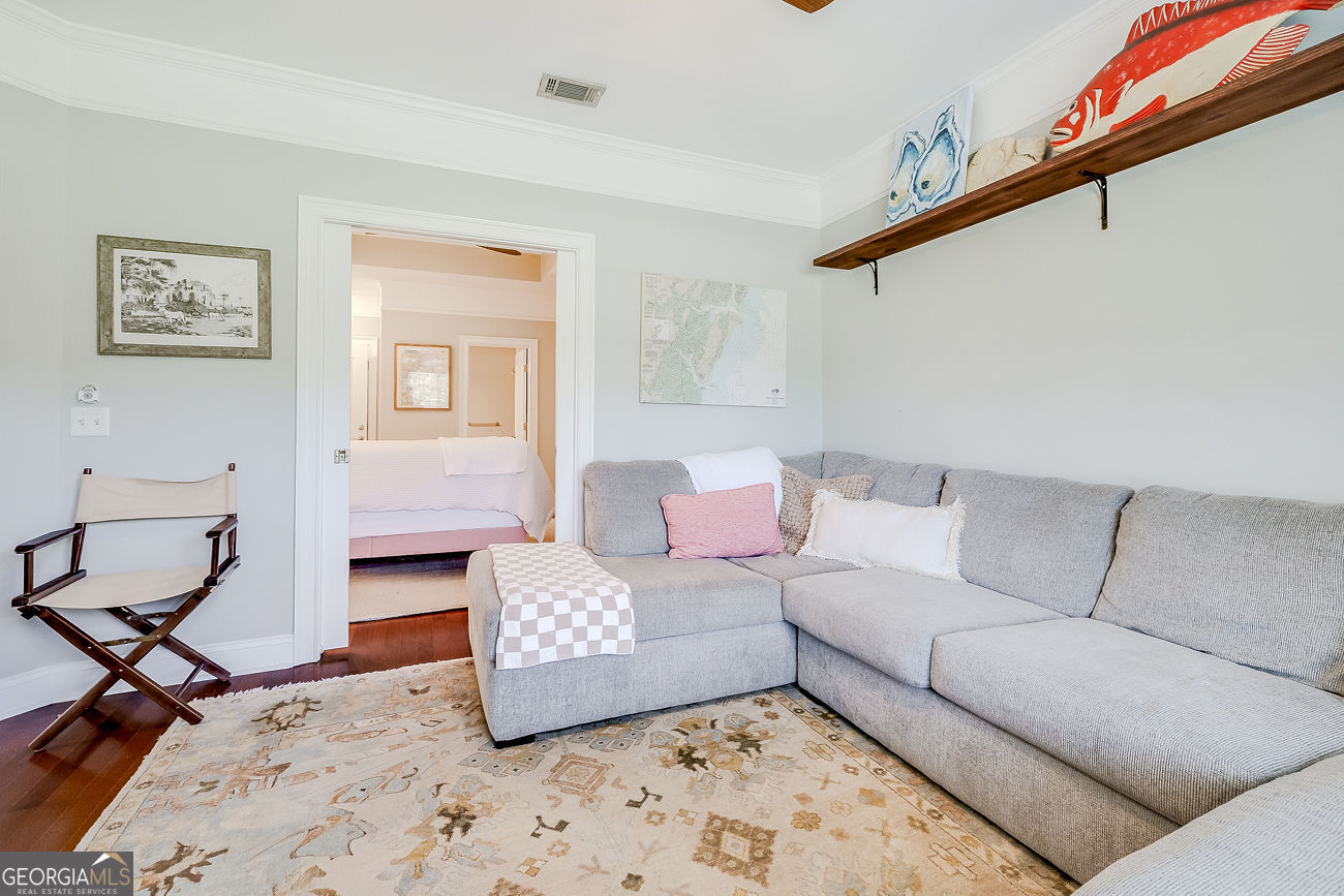7272 Shellman Bluff Road Northeast, Unit 18 Townsend, GA 31331 - Photo 22 of 31 a living room with furniture and a rug