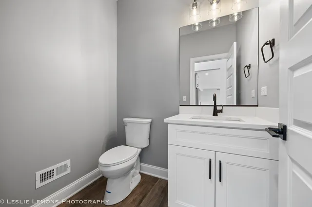 a view of an empty room with a ceiling fan