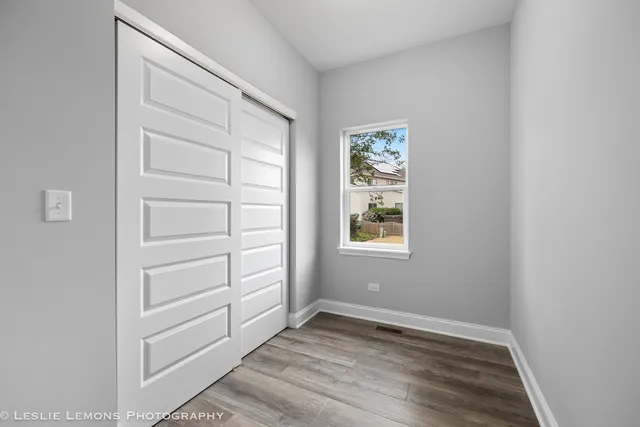 a spacious bathroom with a double vanity sink a mirror and a bathtub