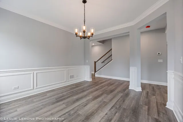 a kitchen with a sink stove top oven and refrigerator