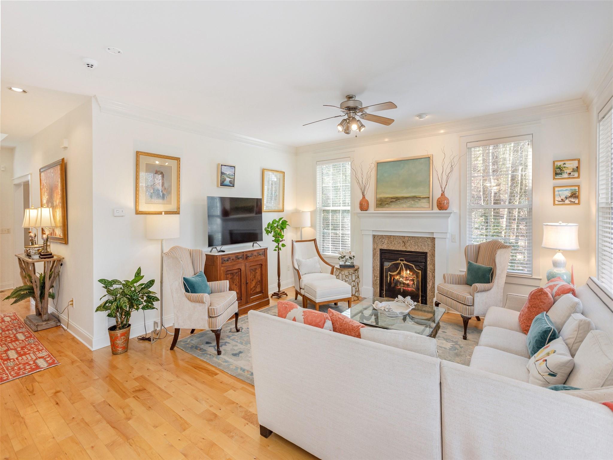 73 Cave Lane Arden, NC 28704 - Photo 13 of 45 a living room with furniture a fireplace and a flat screen tv
