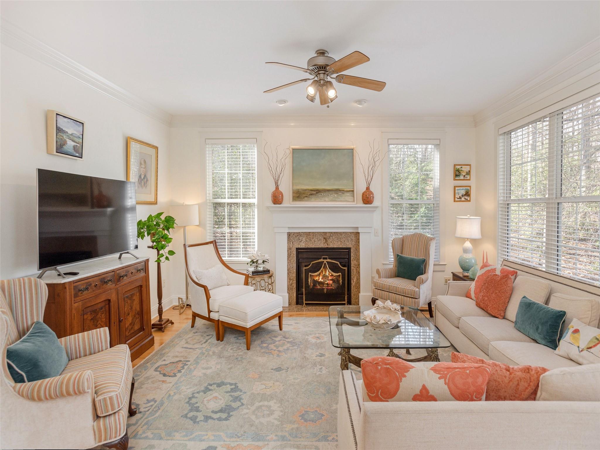73 Cave Lane Arden, NC 28704 - Photo 14 of 45 a living room with furniture a flat screen tv and a fireplace