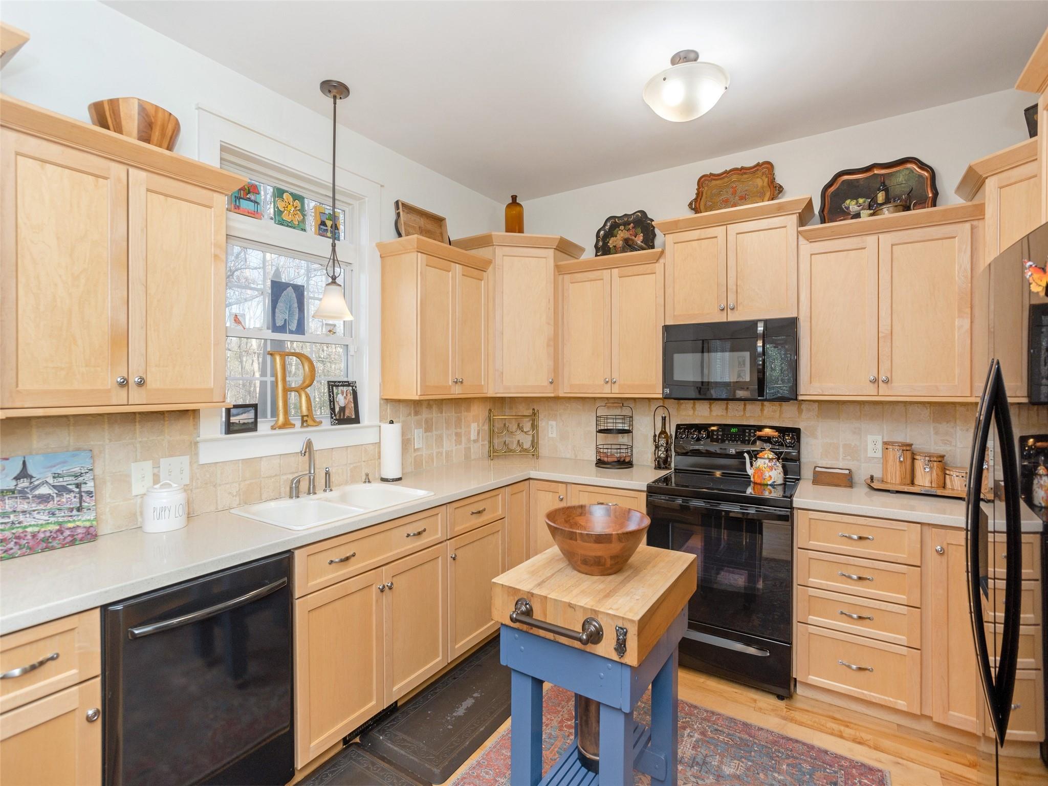 73 Cave Lane Arden, NC 28704 - Photo 19 of 45 a kitchen with granite countertop a sink stove and cabinets