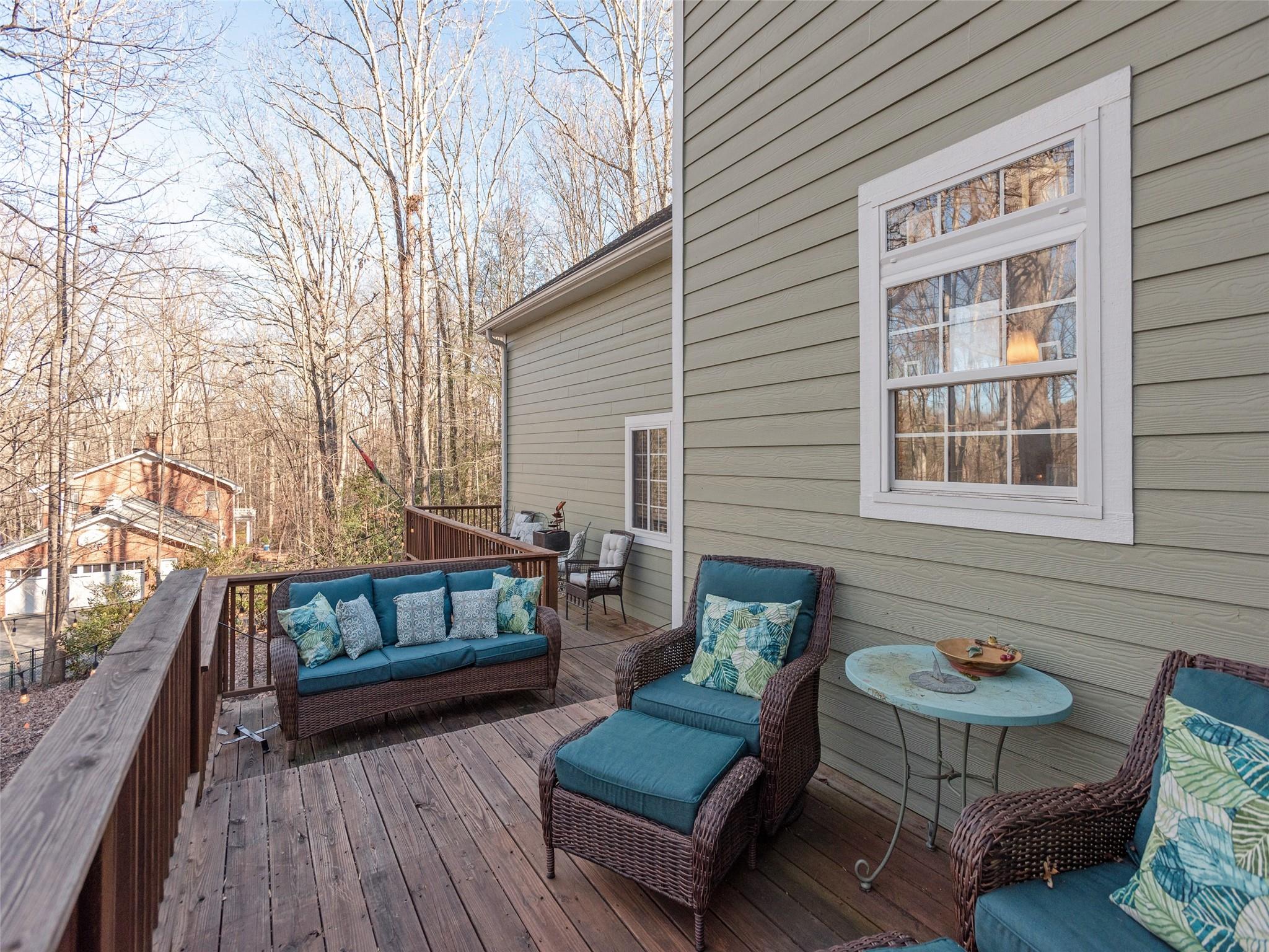 73 Cave Lane Arden, NC 28704 - Photo 21 of 45 a view of a patio with couches and a potted plant on a table