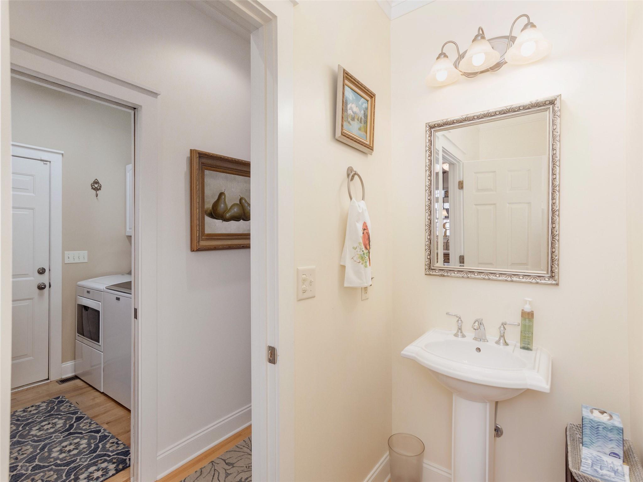 73 Cave Lane Arden, NC 28704 - Photo 23 of 45 a bathroom with a sink a mirror and a toilet