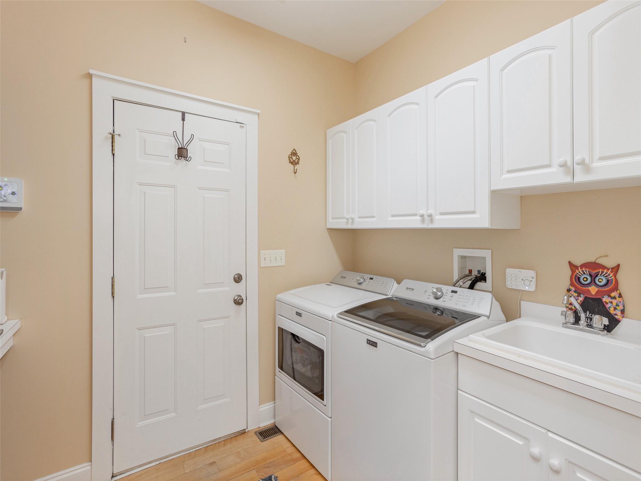 73 Cave Lane Arden, NC 28704 - Photo 24 of 45 a view of washer and dryer with kitchen countertops