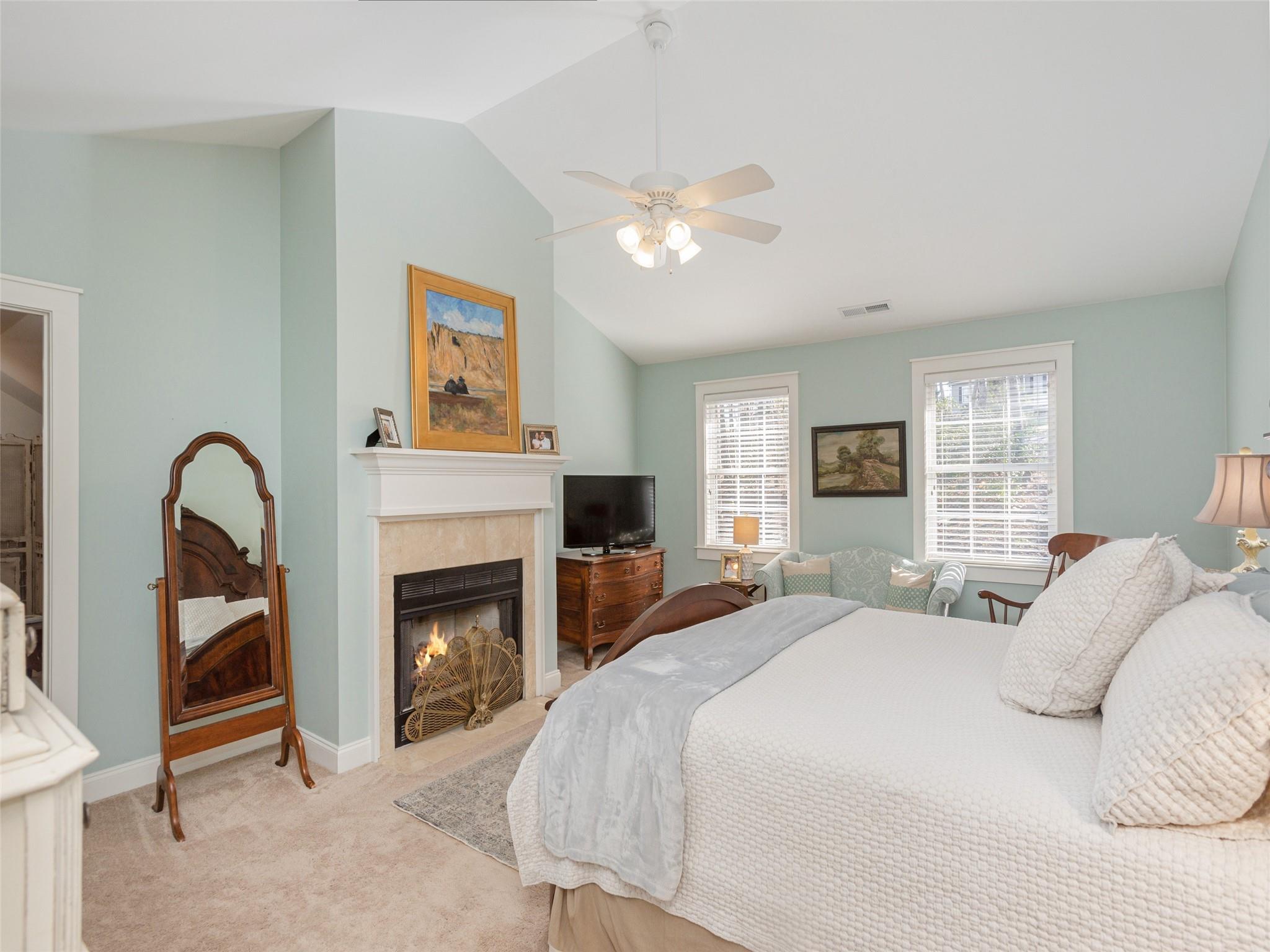 73 Cave Lane Arden, NC 28704 - Photo 26 of 45 a bedroom with a bed and a fireplace