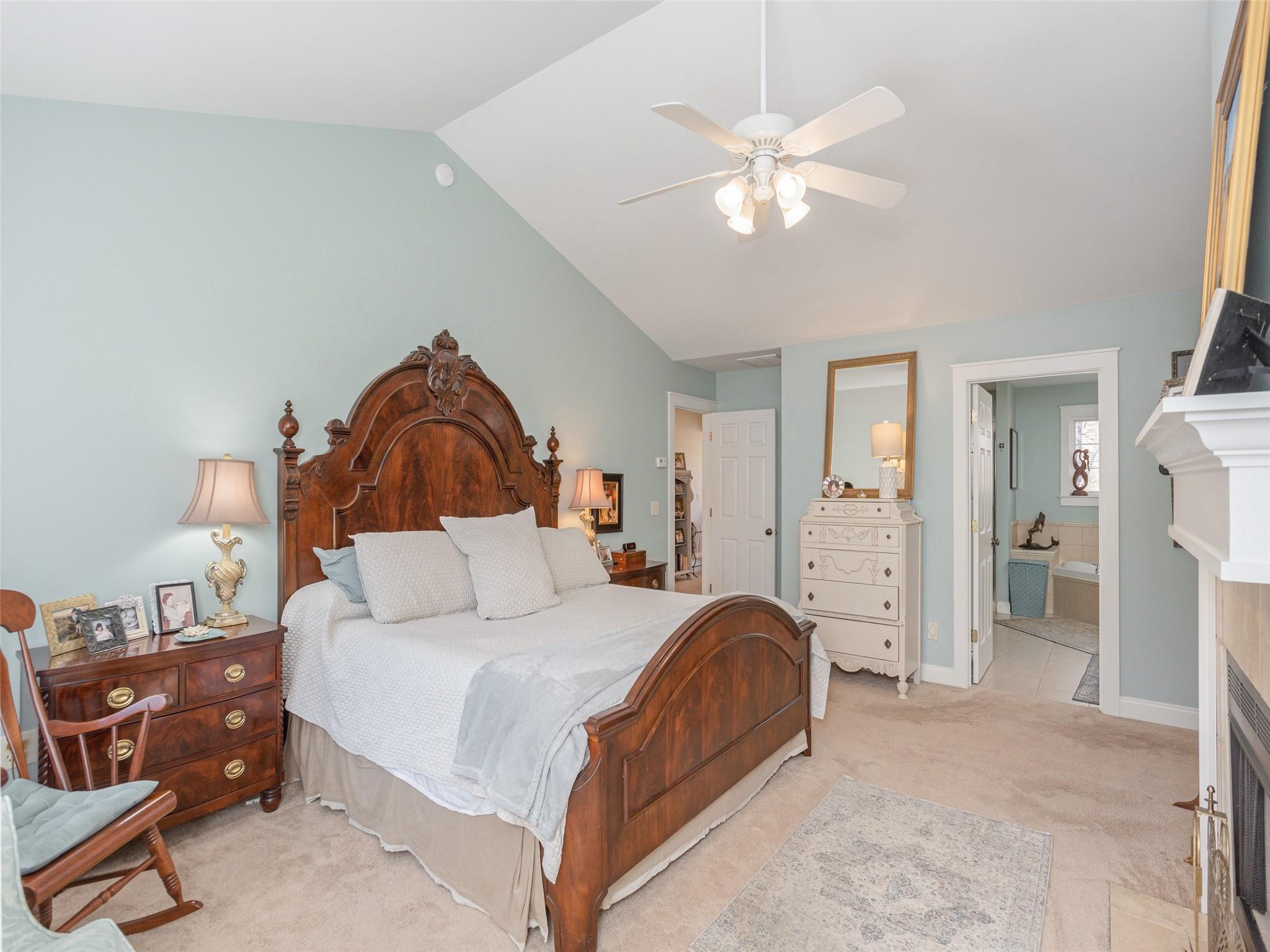 73 Cave Lane Arden, NC 28704 - Photo 27 of 45 a bedroom with a bed and a chandelier