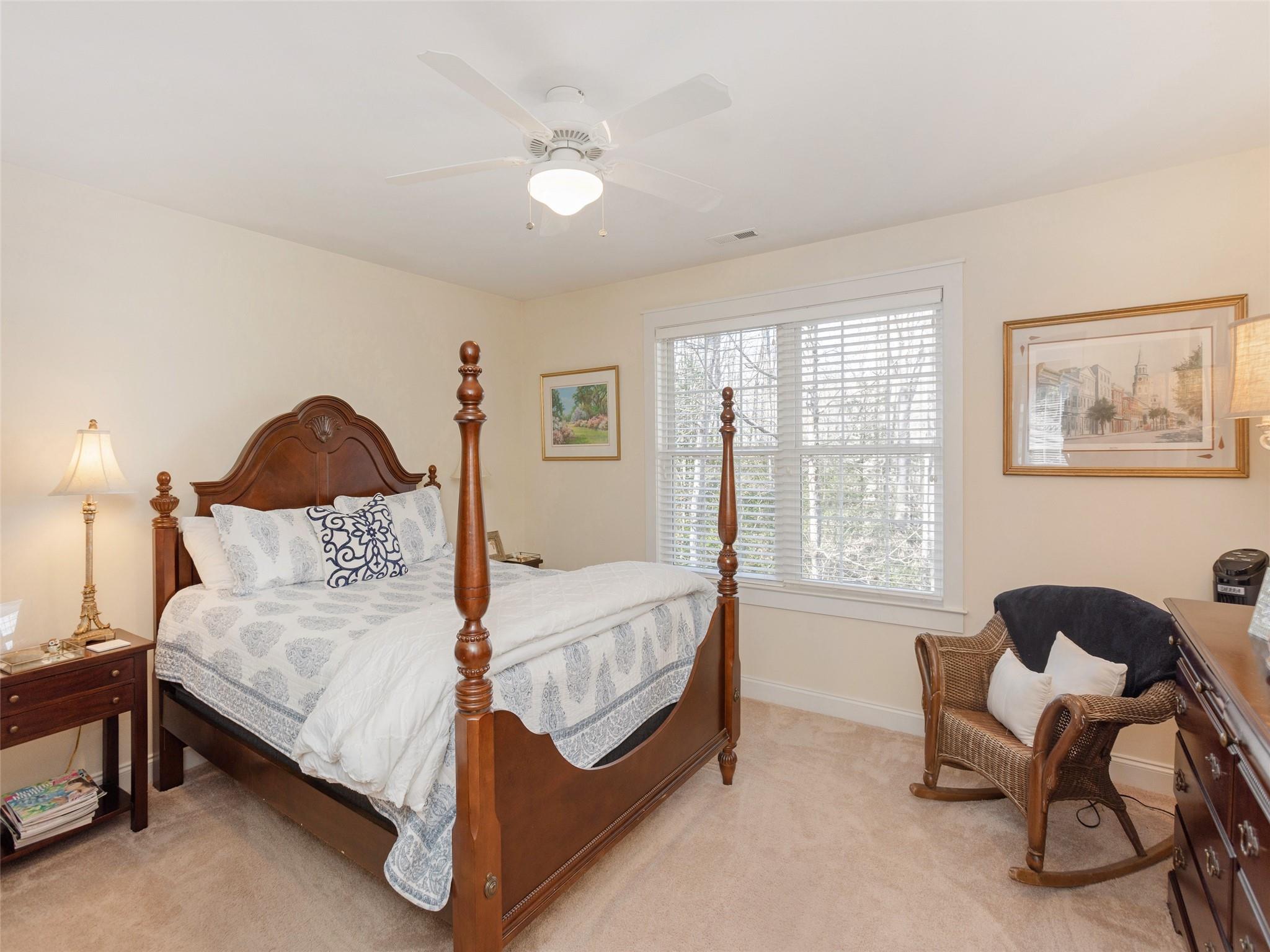 73 Cave Lane Arden, NC 28704 - Photo 31 of 45 a bedroom with a bed chair and a window