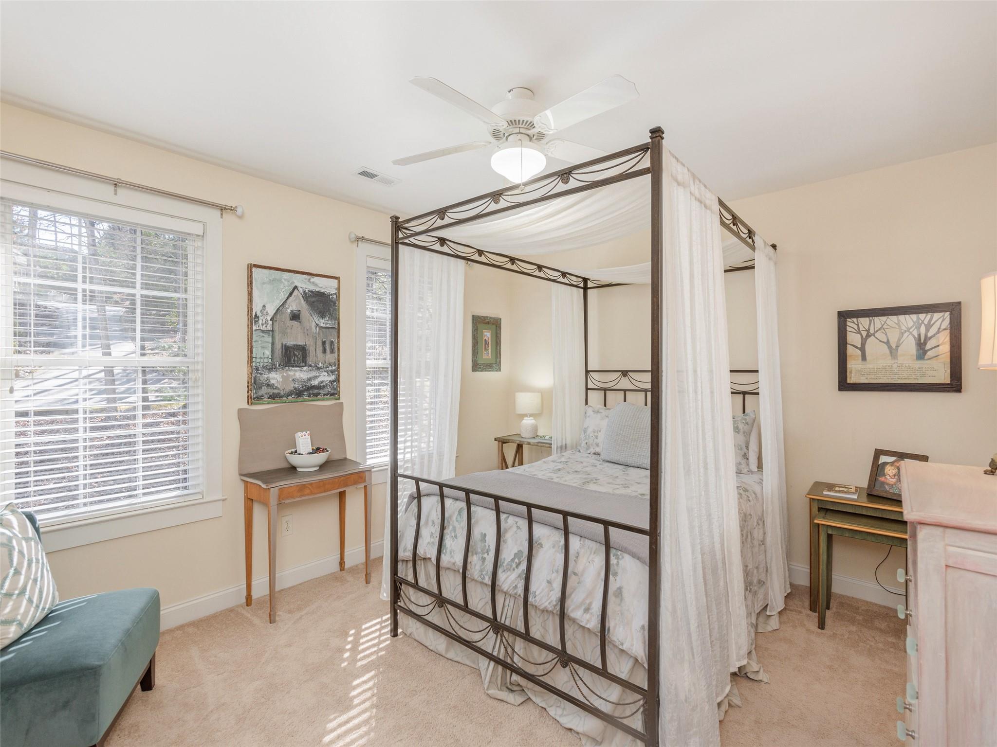 73 Cave Lane Arden, NC 28704 - Photo 34 of 45 a view of a bedroom with furniture and windows