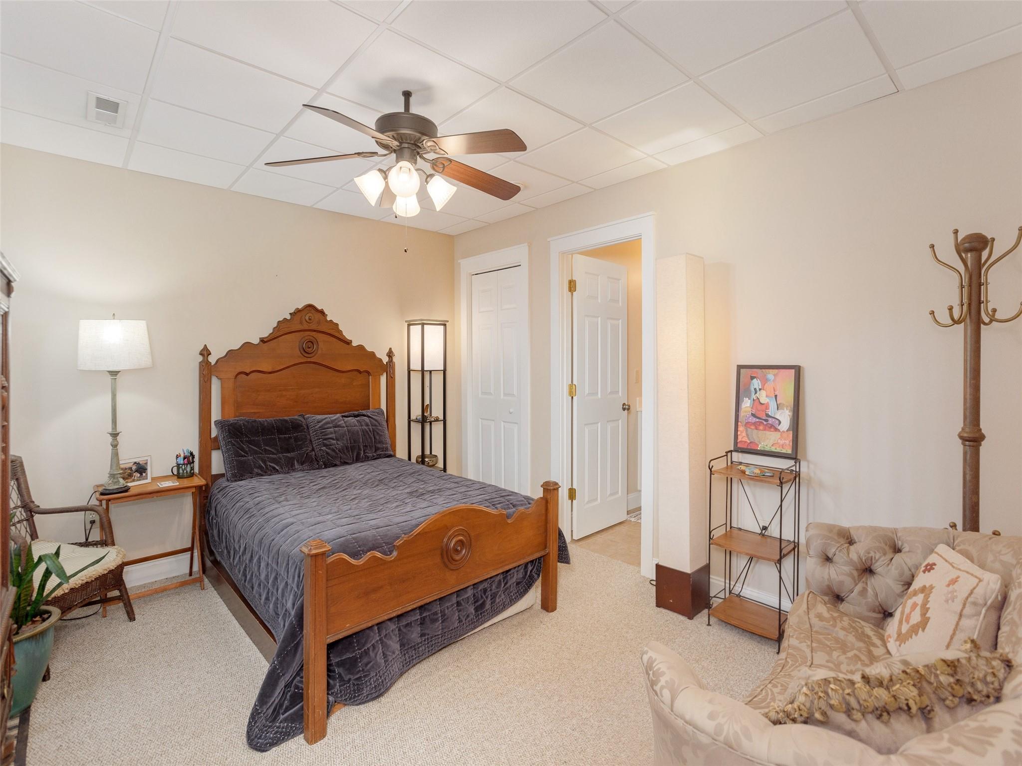 73 Cave Lane Arden, NC 28704 - Photo 39 of 45 a bedroom with a bed and a chandelier