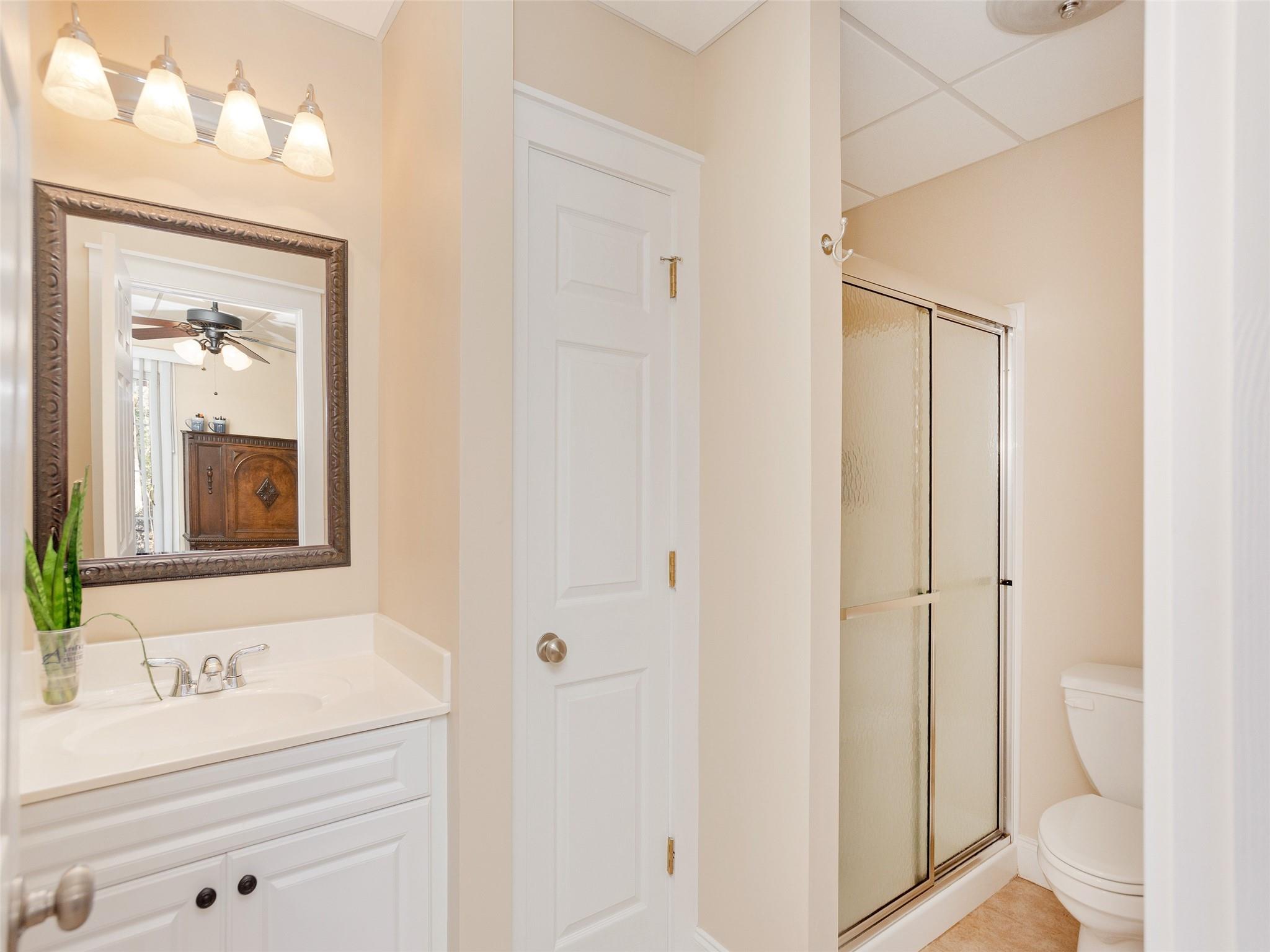 73 Cave Lane Arden, NC 28704 - Photo 40 of 45 a bathroom with a sink a toilet and a mirror