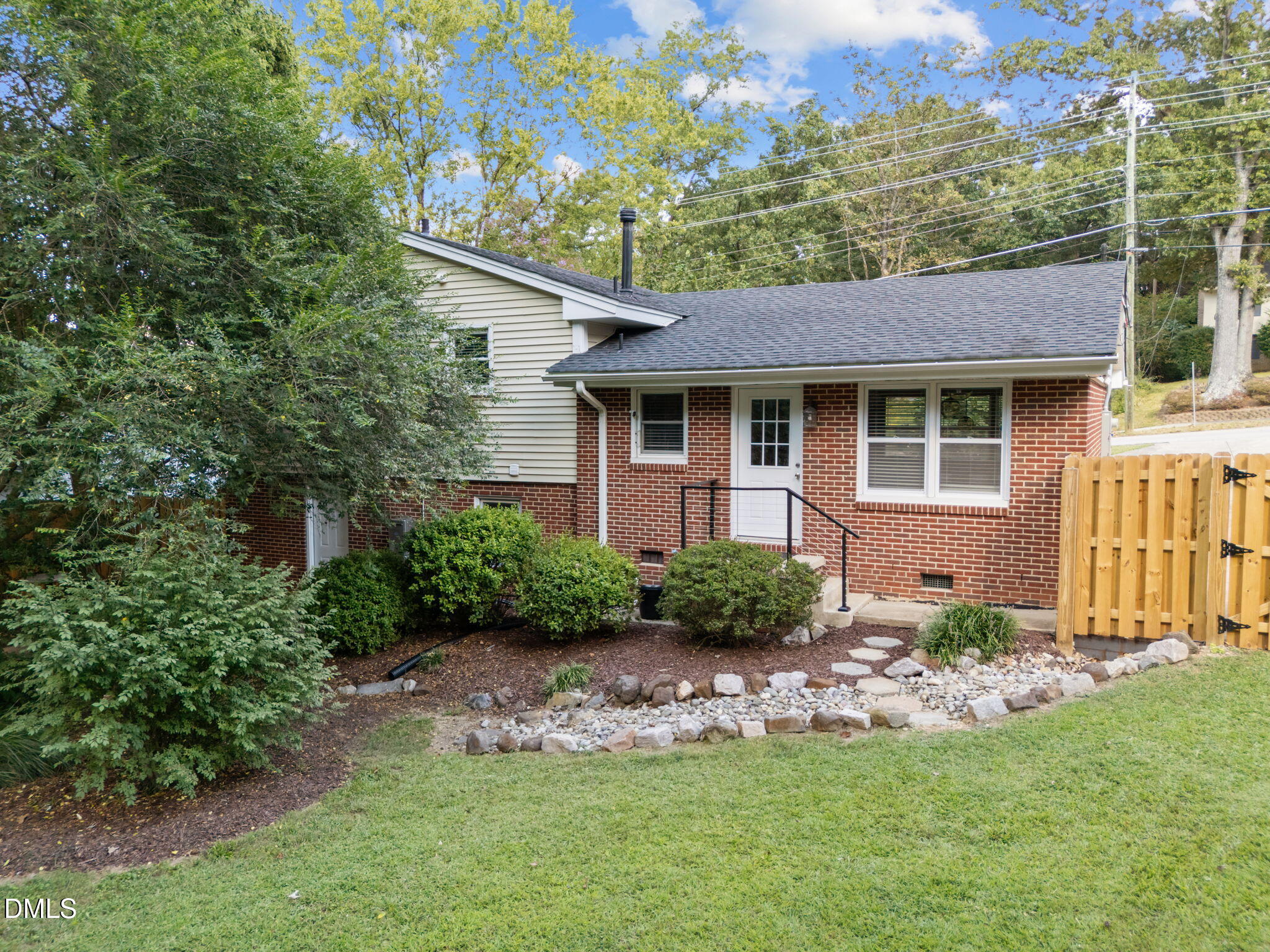 3523 Brentwood Road Raleigh, NC 27604 - Photo 7 of 43 a front view of a house with a yard and outdoor seating
