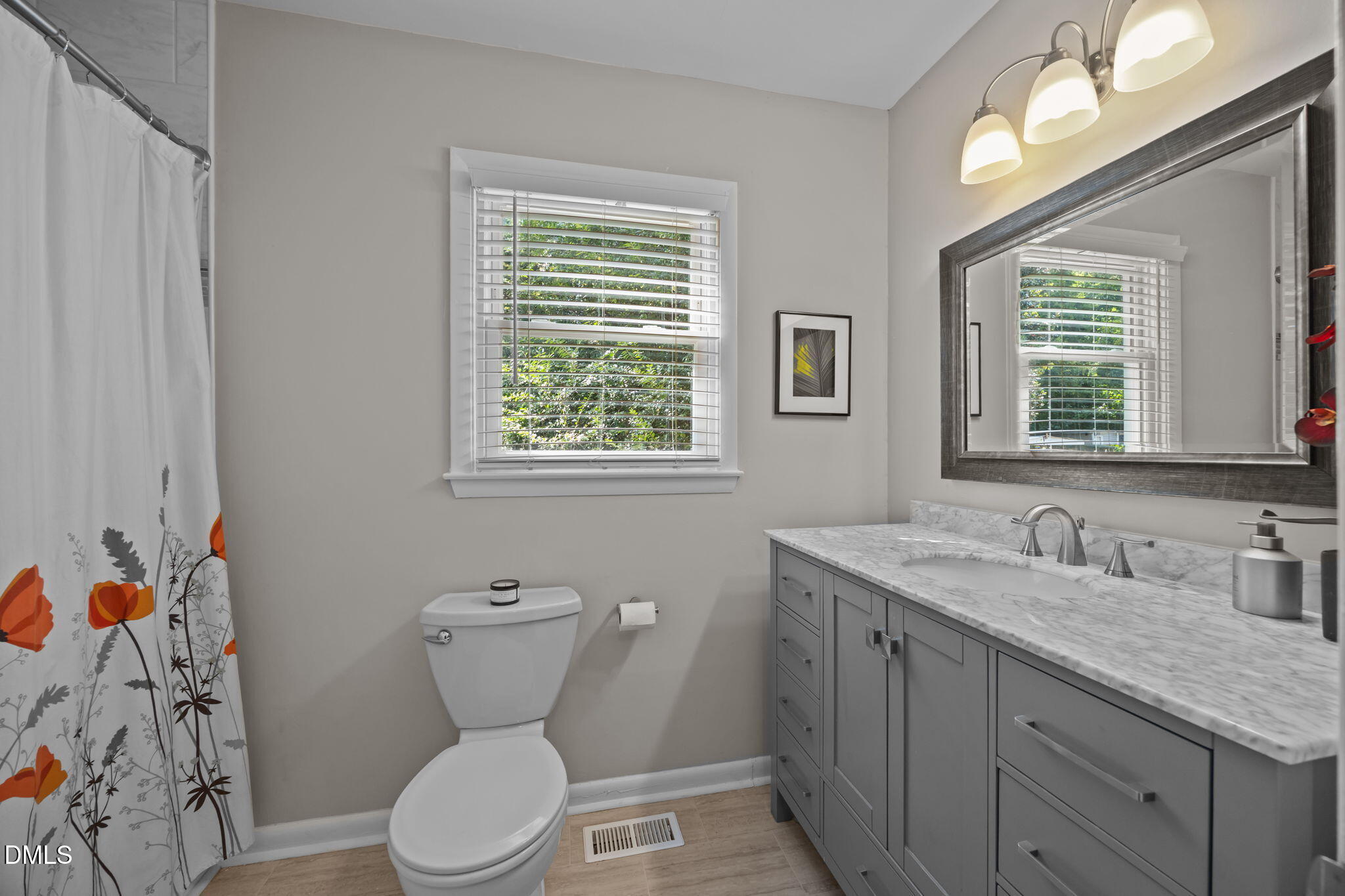 3523 Brentwood Road Raleigh, NC 27604 - Photo 23 of 43 a bathroom with a granite countertop toilet sink and mirror