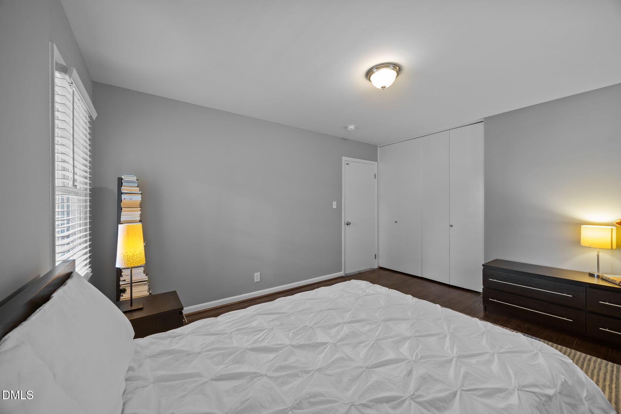 3523 Brentwood Road Raleigh, NC 27604 - Photo 27 of 43 a bedroom with a bed and a lamp