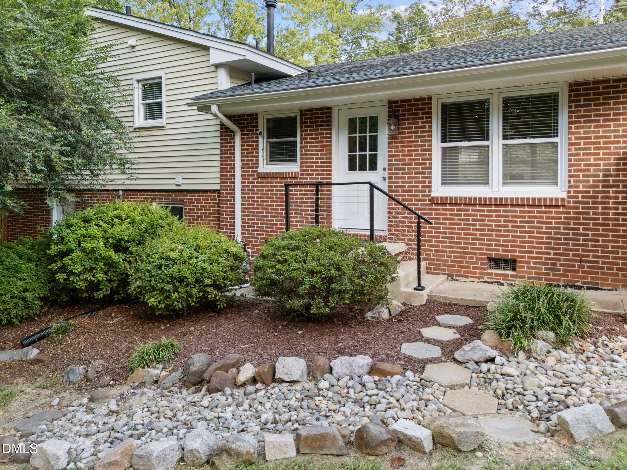 3523 Brentwood Road Raleigh, NC 27604 - Photo 5 of 43 a front view of a house with garden
