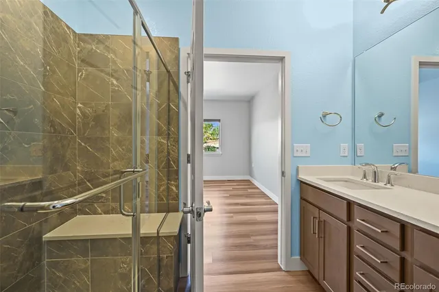 a bathroom with a double vanity sink and a mirror