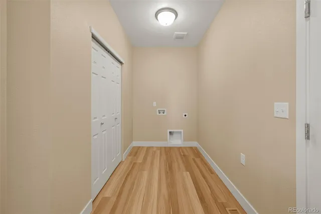 a view of wooden floor in a bathroom