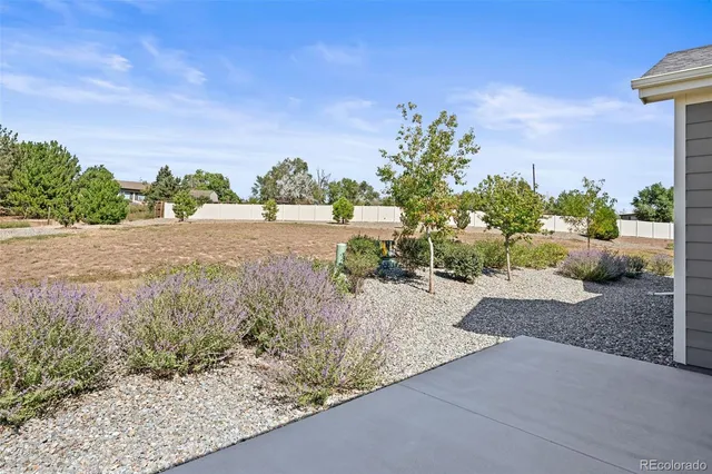 a view of a backyard of the house