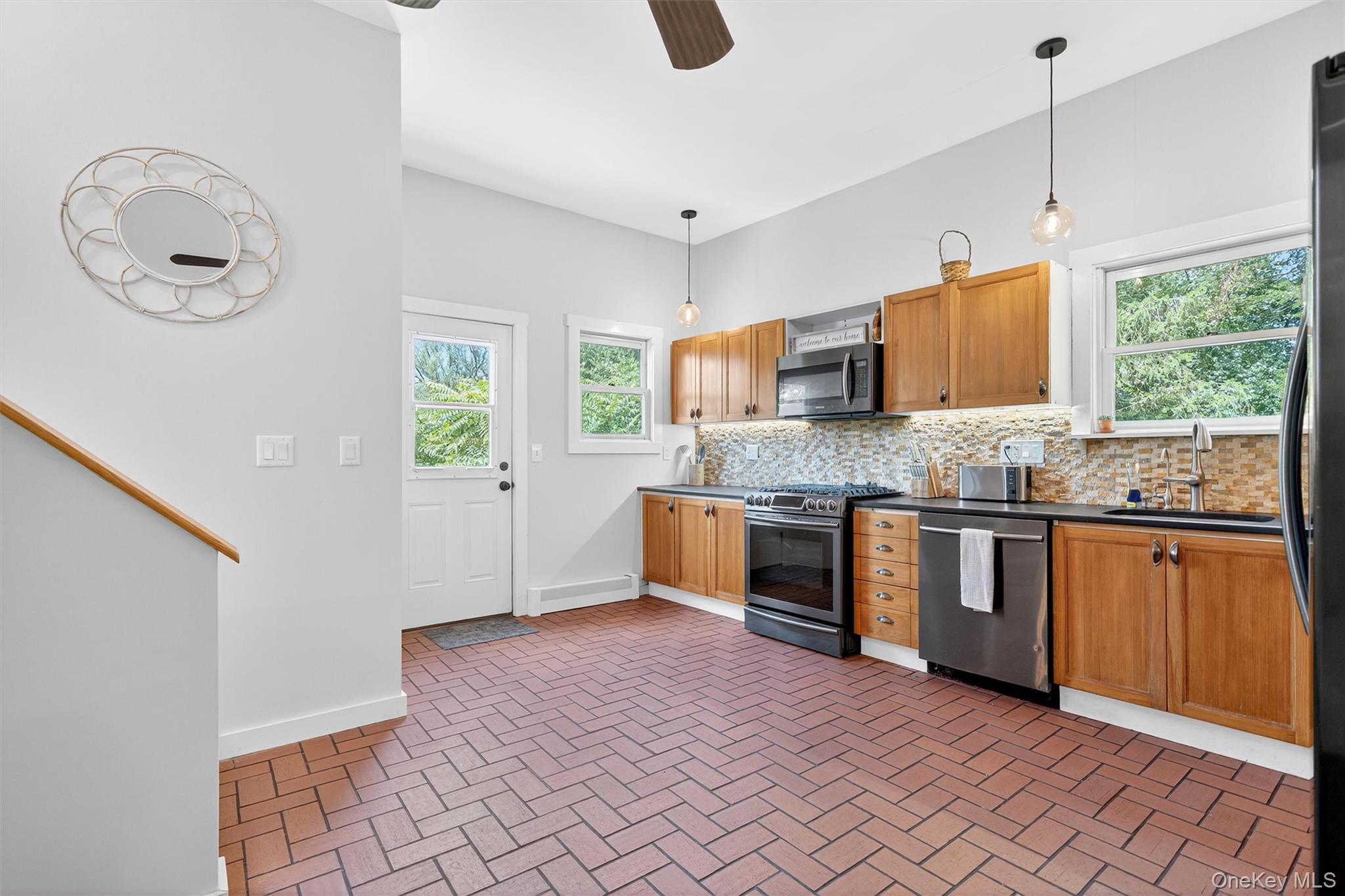 321 Bellvale Lakes Road Warwick, NY 10990 - Photo 11 of 33 a kitchen with stainless steel appliances granite countertop a sink and a granite counter tops