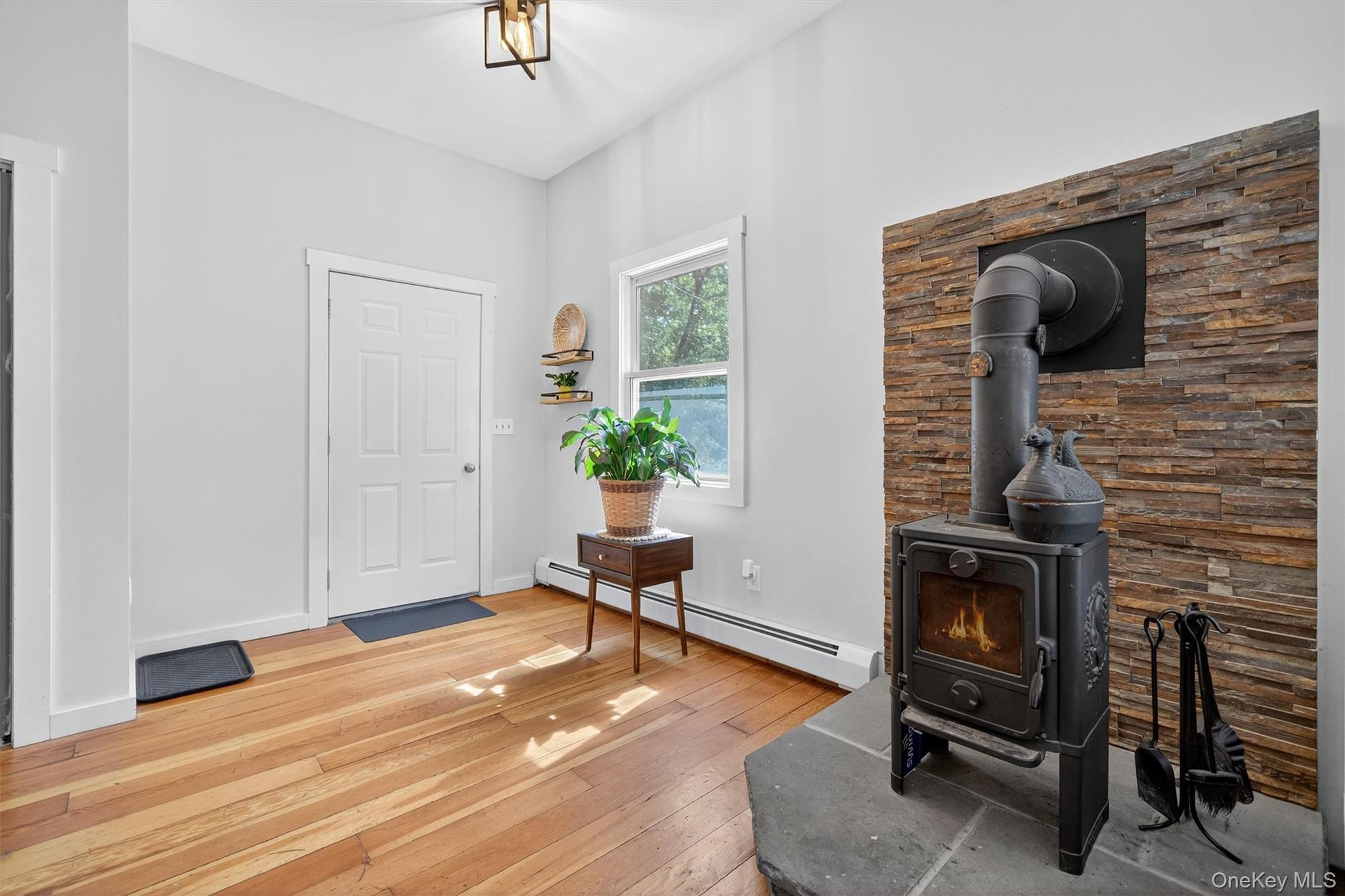 321 Bellvale Lakes Road Warwick, NY 10990 - Photo 13 of 33 a living room with furniture and a fireplace