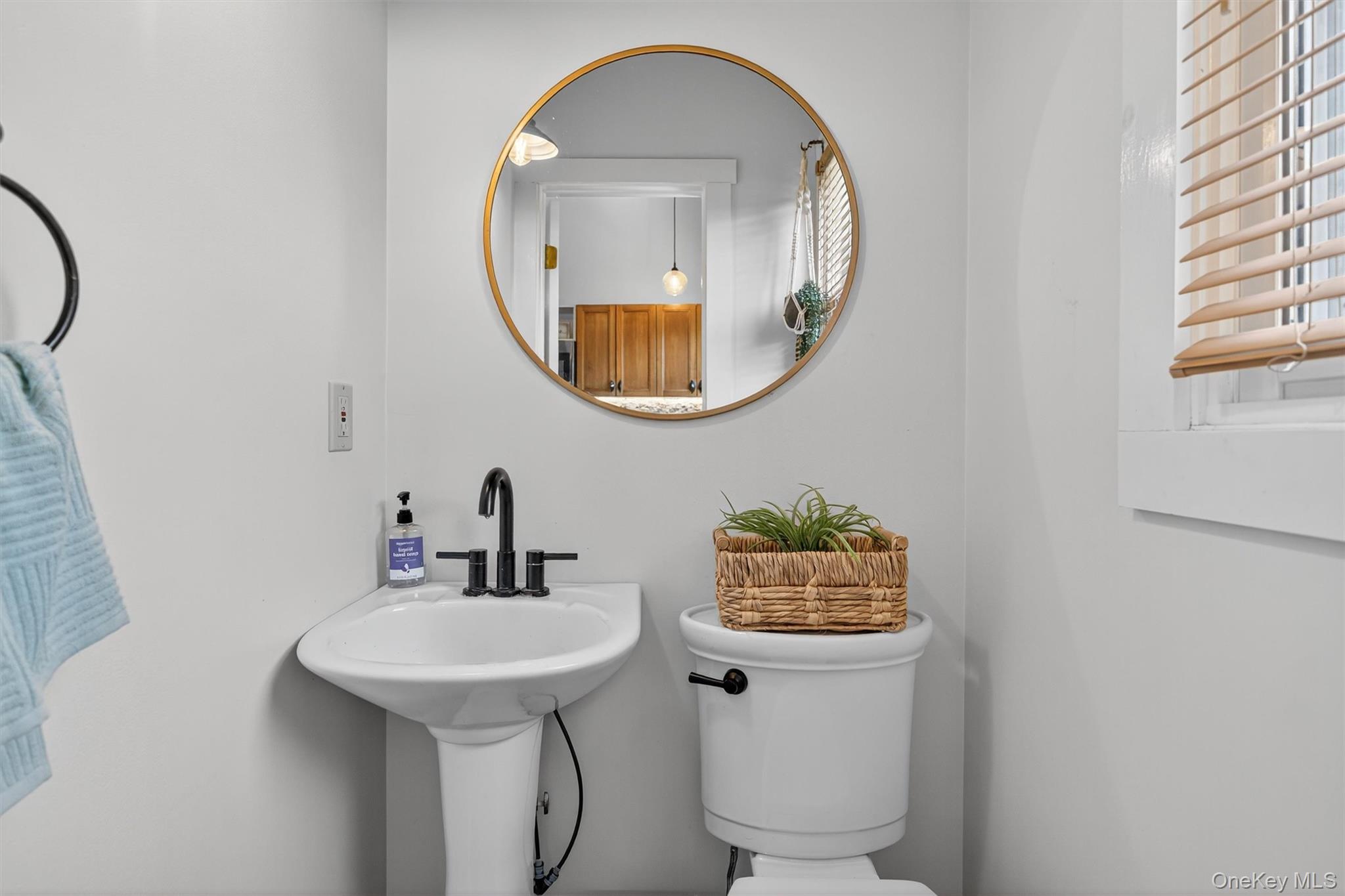 321 Bellvale Lakes Road Warwick, NY 10990 - Photo 14 of 33 a bathroom with a sink and a mirror