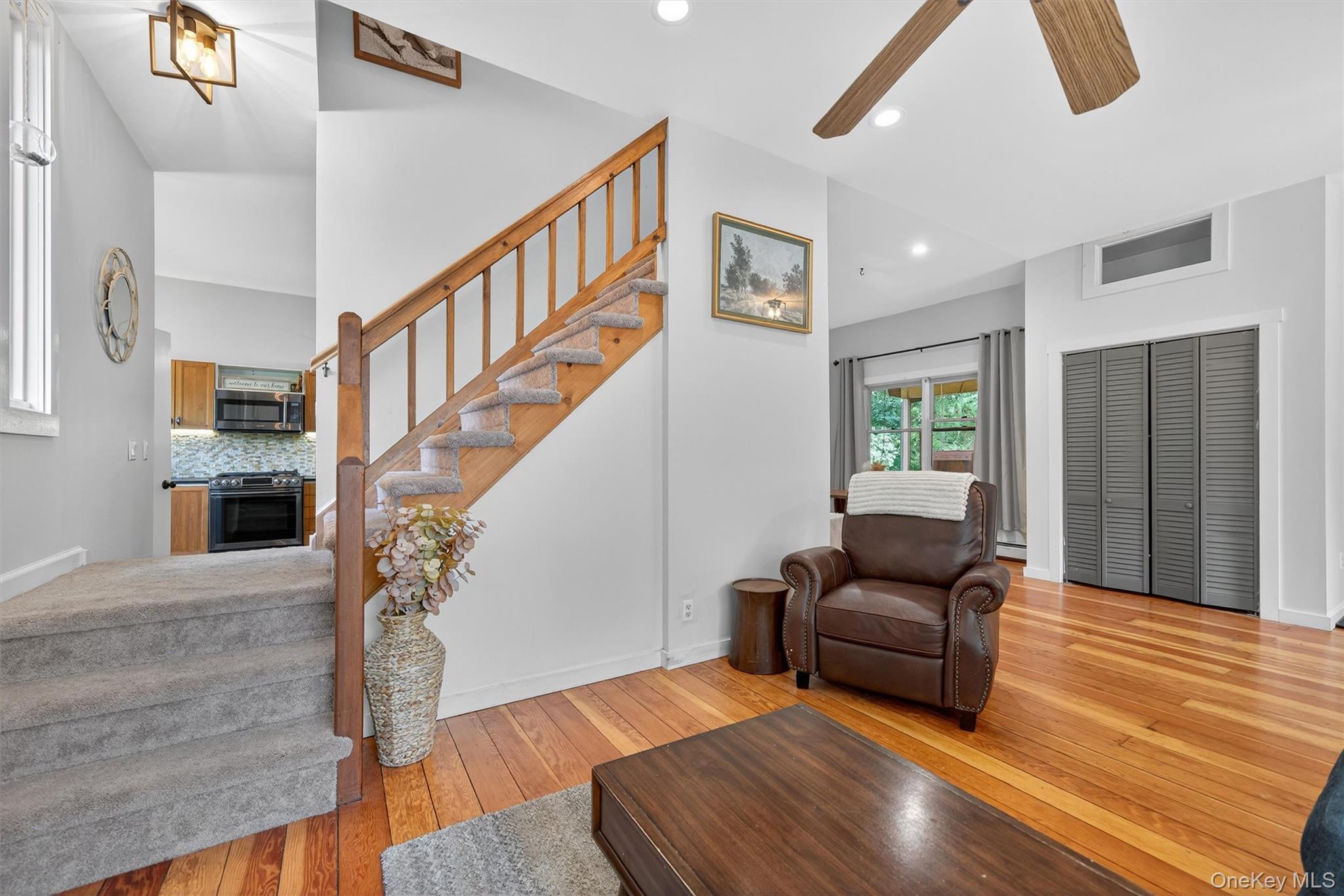 321 Bellvale Lakes Road Warwick, NY 10990 - Photo 16 of 33 a living room with furniture and wooden floor