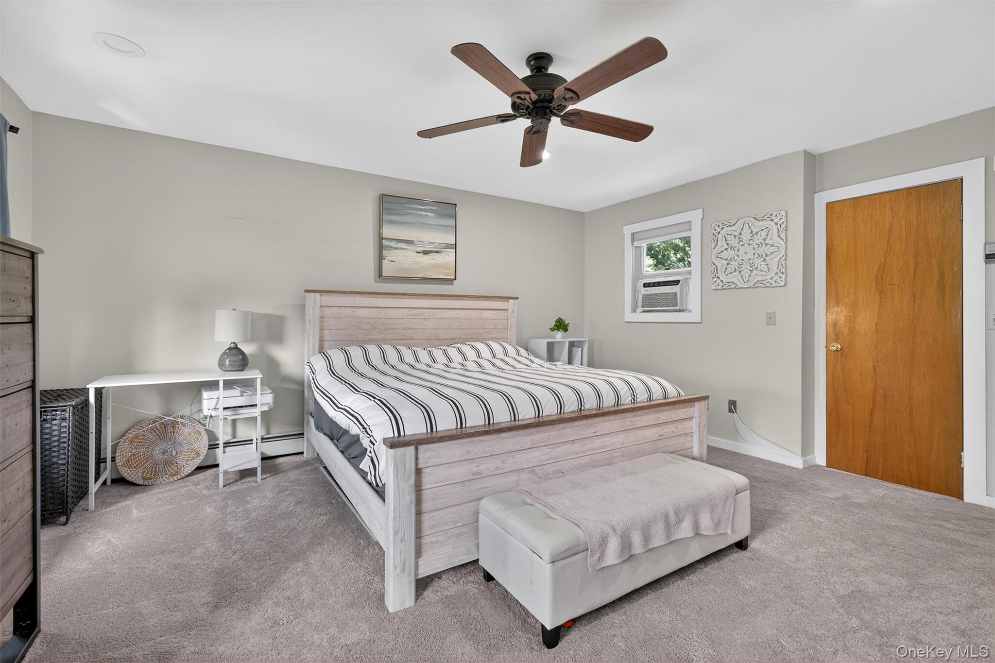 321 Bellvale Lakes Road Warwick, NY 10990 - Photo 18 of 33 a bedroom with a bed and a chandelier