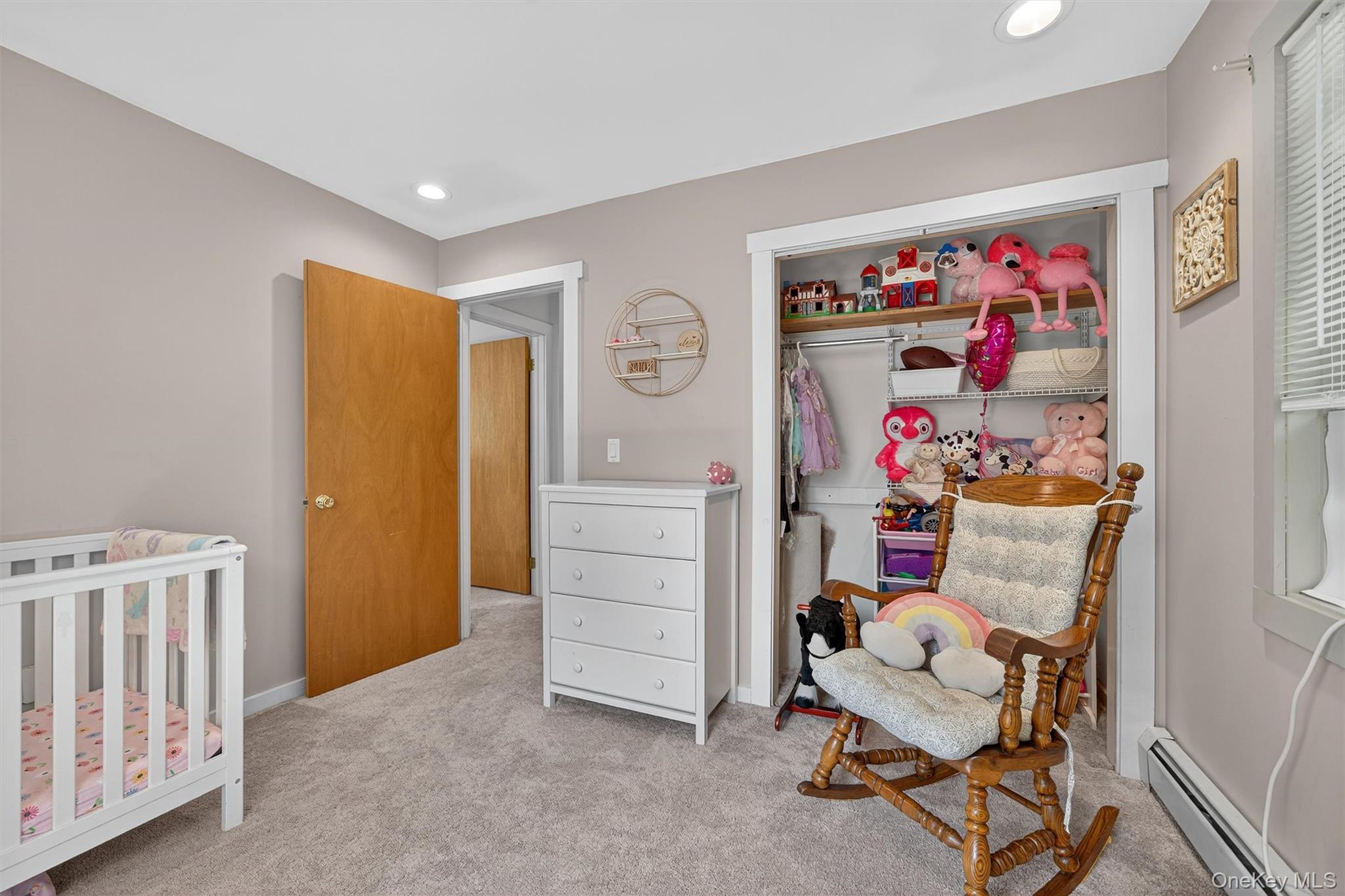 321 Bellvale Lakes Road Warwick, NY 10990 - Photo 20 of 33 a view of a bedroom with baby crib and furniture
