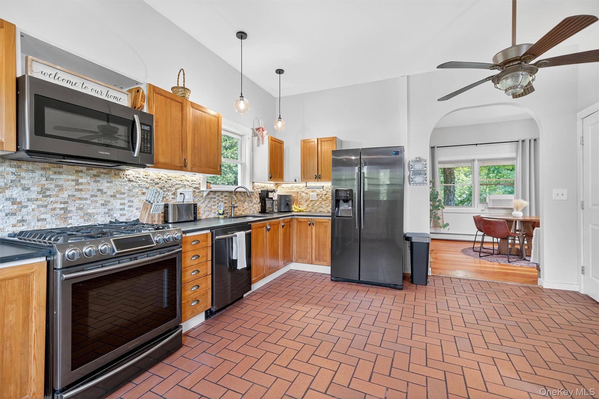 321 Bellvale Lakes Road Warwick, NY 10990 - Photo 2 of 33 a kitchen with a stove a microwave and refrigerator