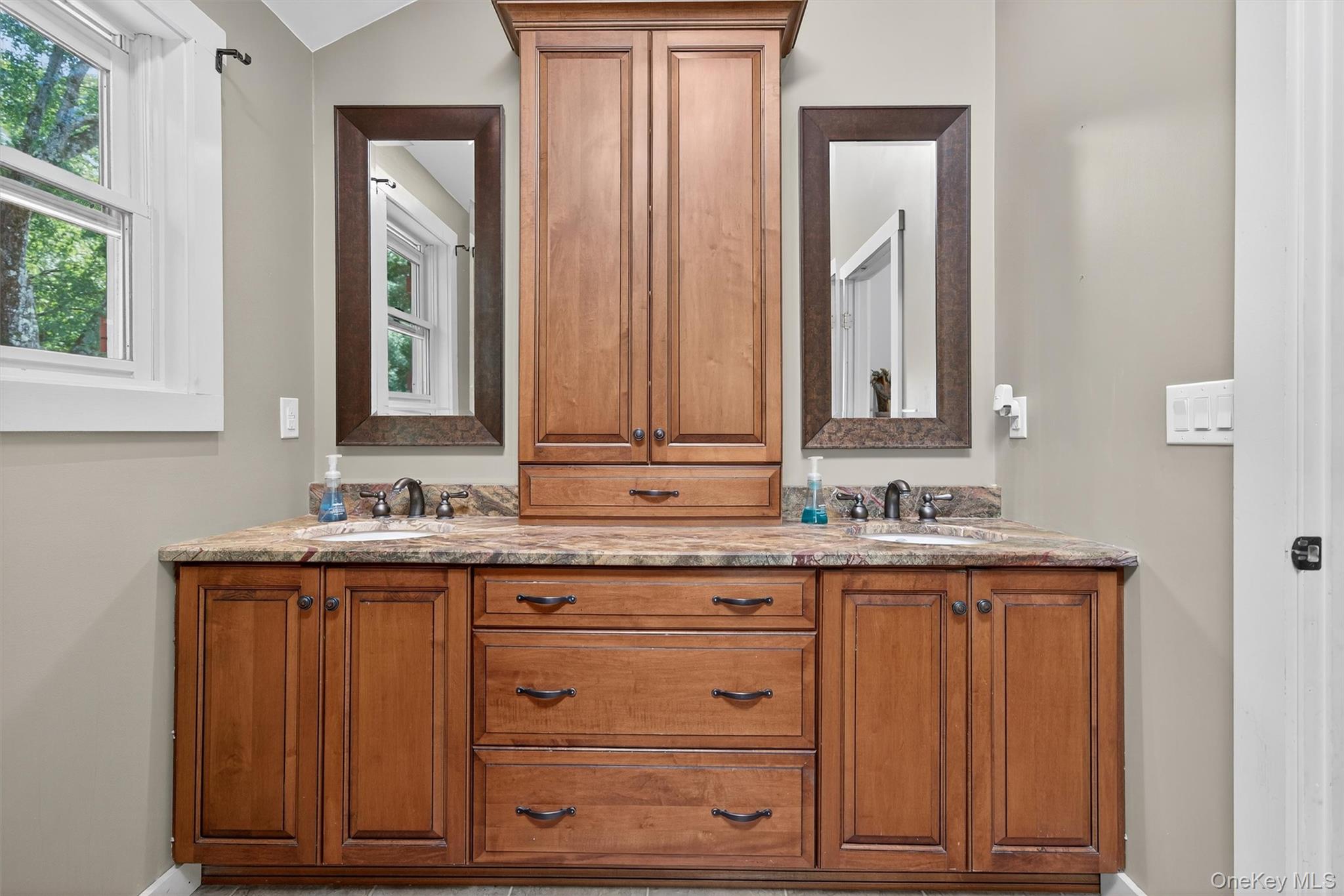 321 Bellvale Lakes Road Warwick, NY 10990 - Photo 23 of 33 a bathroom with a sink and a mirror