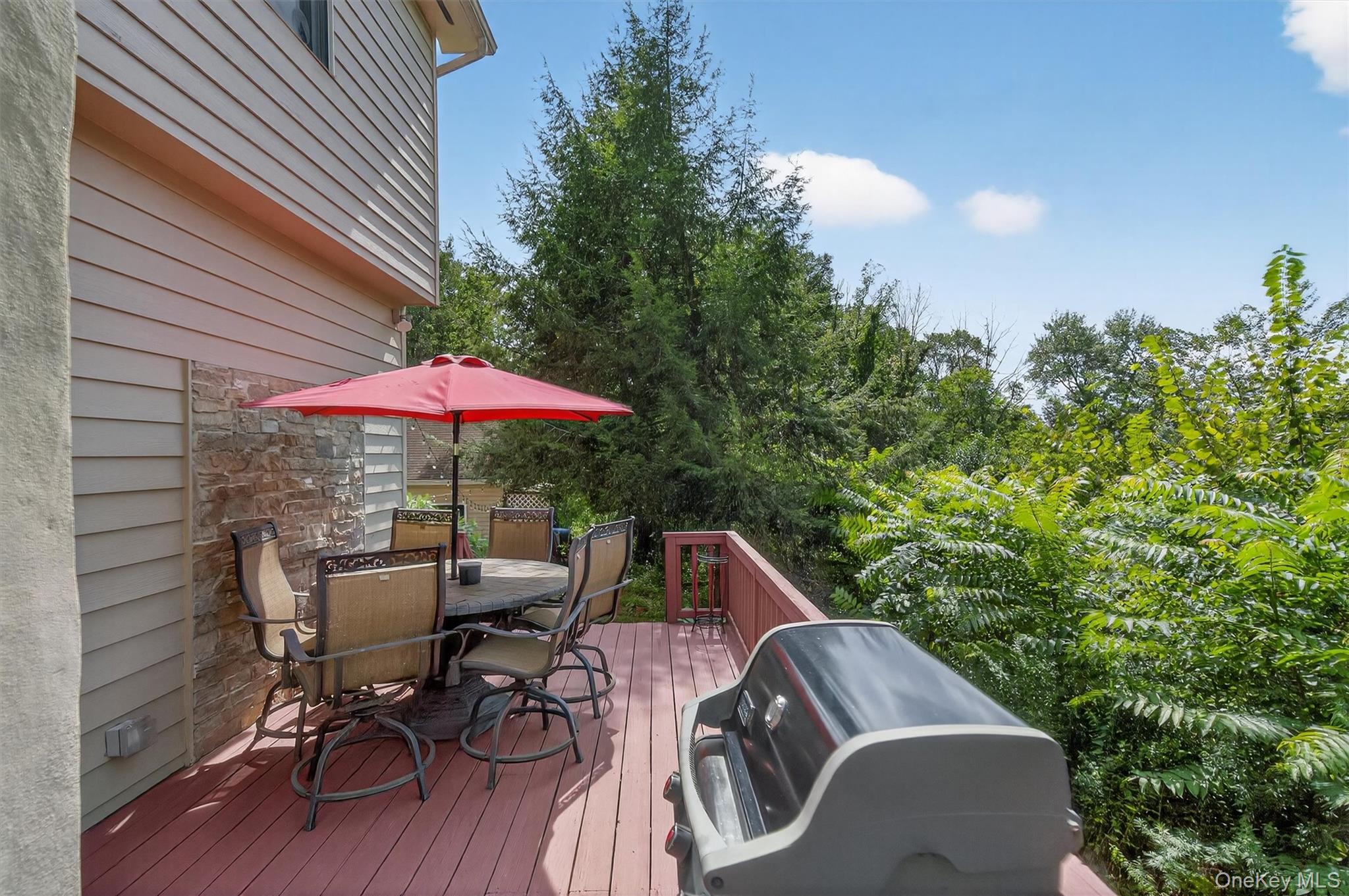 321 Bellvale Lakes Road Warwick, NY 10990 - Photo 27 of 33 a view of backyard with seating space and trees