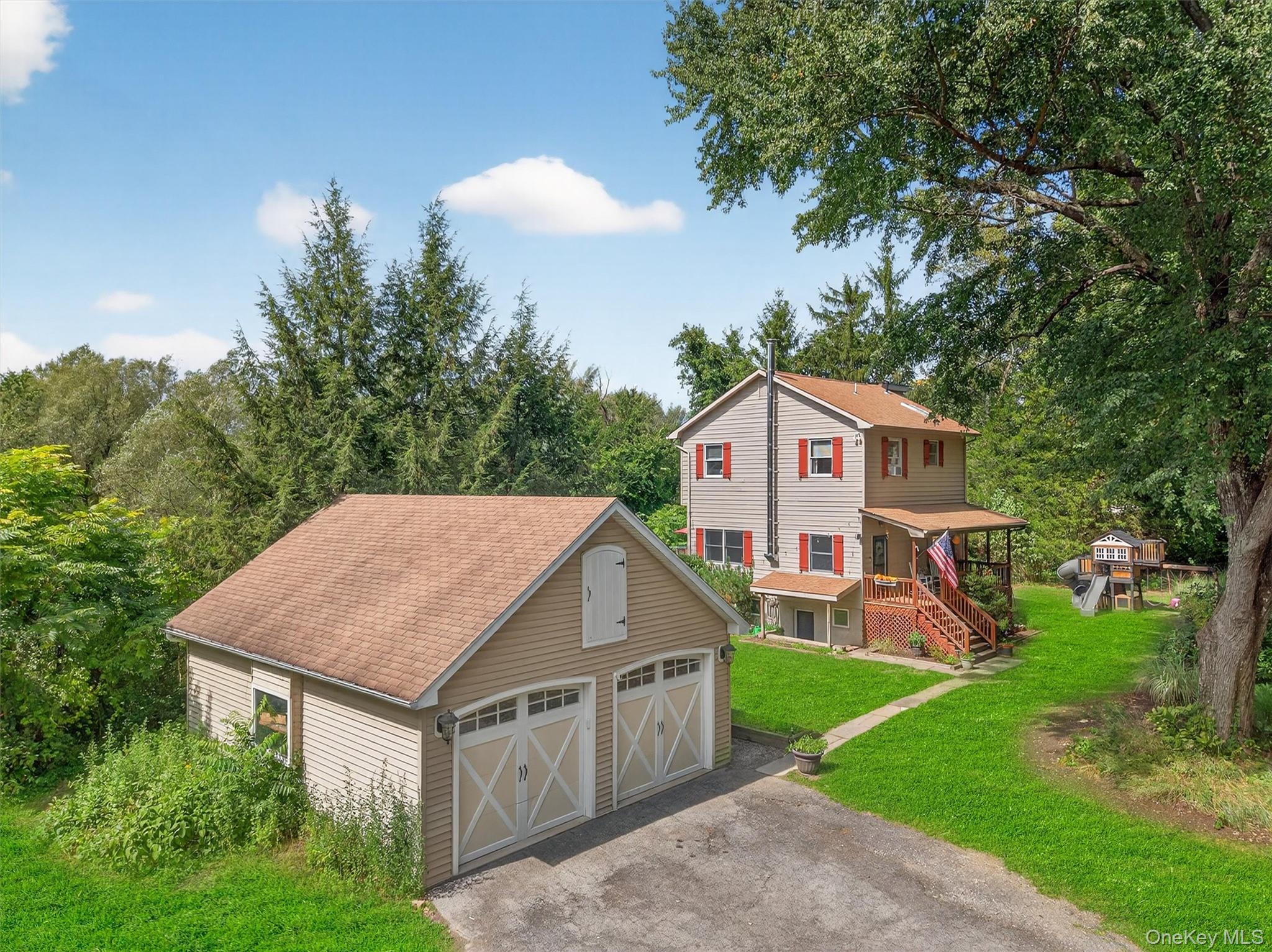 321 Bellvale Lakes Road Warwick, NY 10990 - Photo 31 of 33 a aerial view of a house next to a big yard and large trees