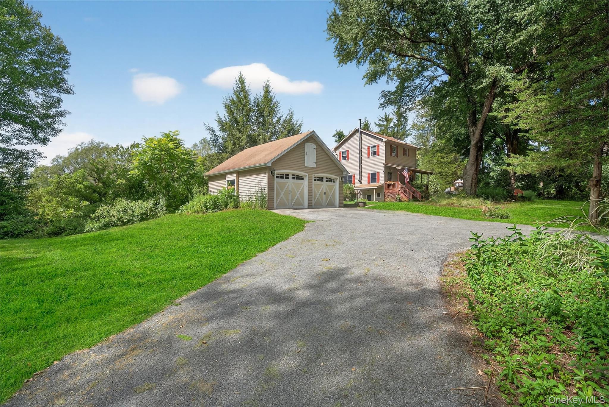 321 Bellvale Lakes Road Warwick, NY 10990 - Photo 6 of 33 a view of a house with a yard and large trees