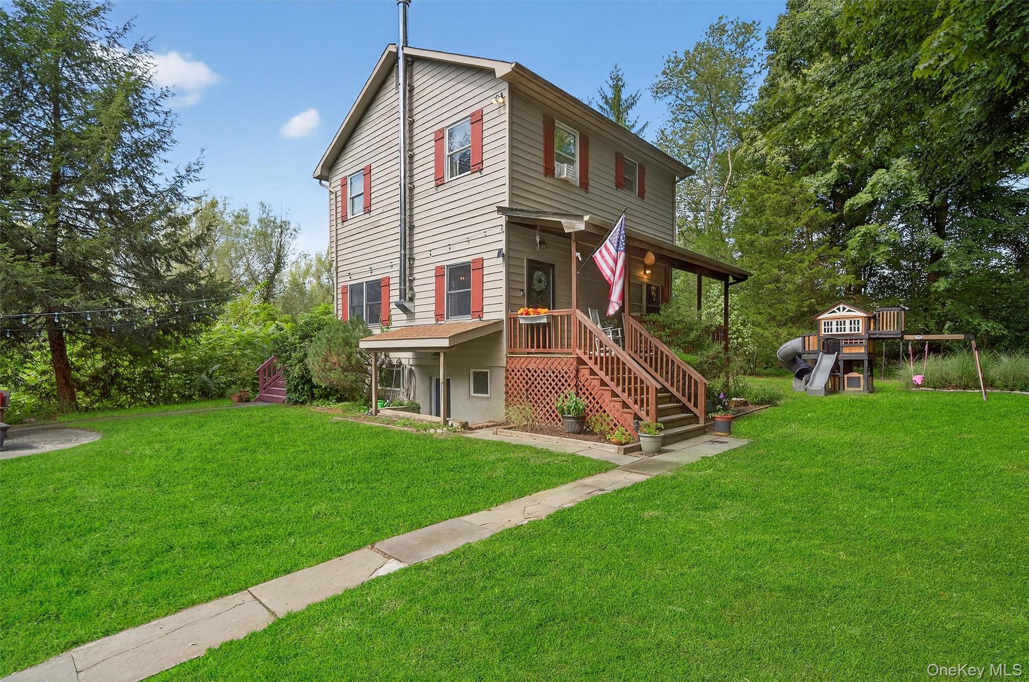 321 Bellvale Lakes Road Warwick, NY 10990 - Photo 7 of 33 a view of a house with a yard and sitting area