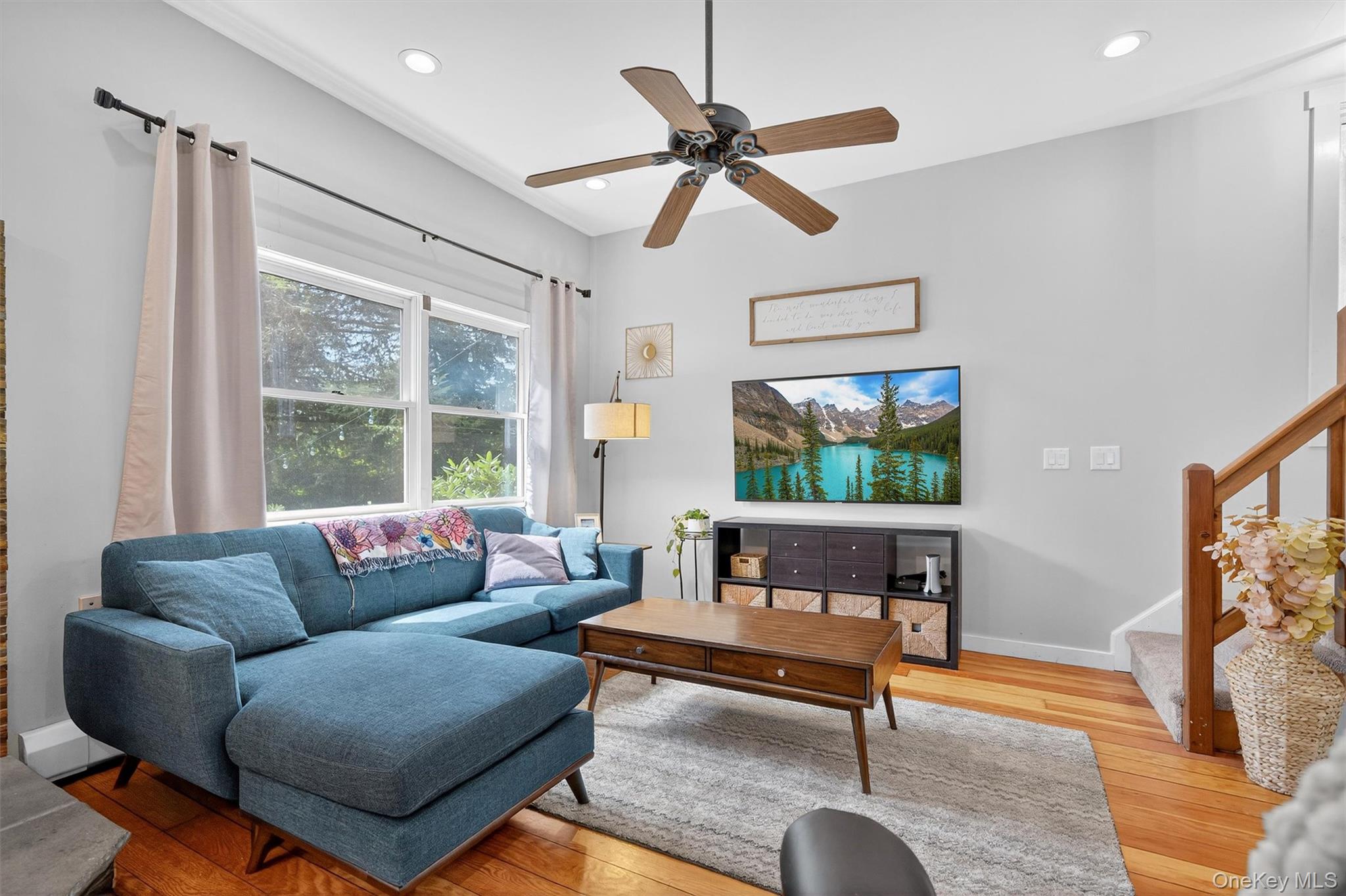 321 Bellvale Lakes Road Warwick, NY 10990 - Photo 8 of 33 a living room with furniture a flat screen tv and a window