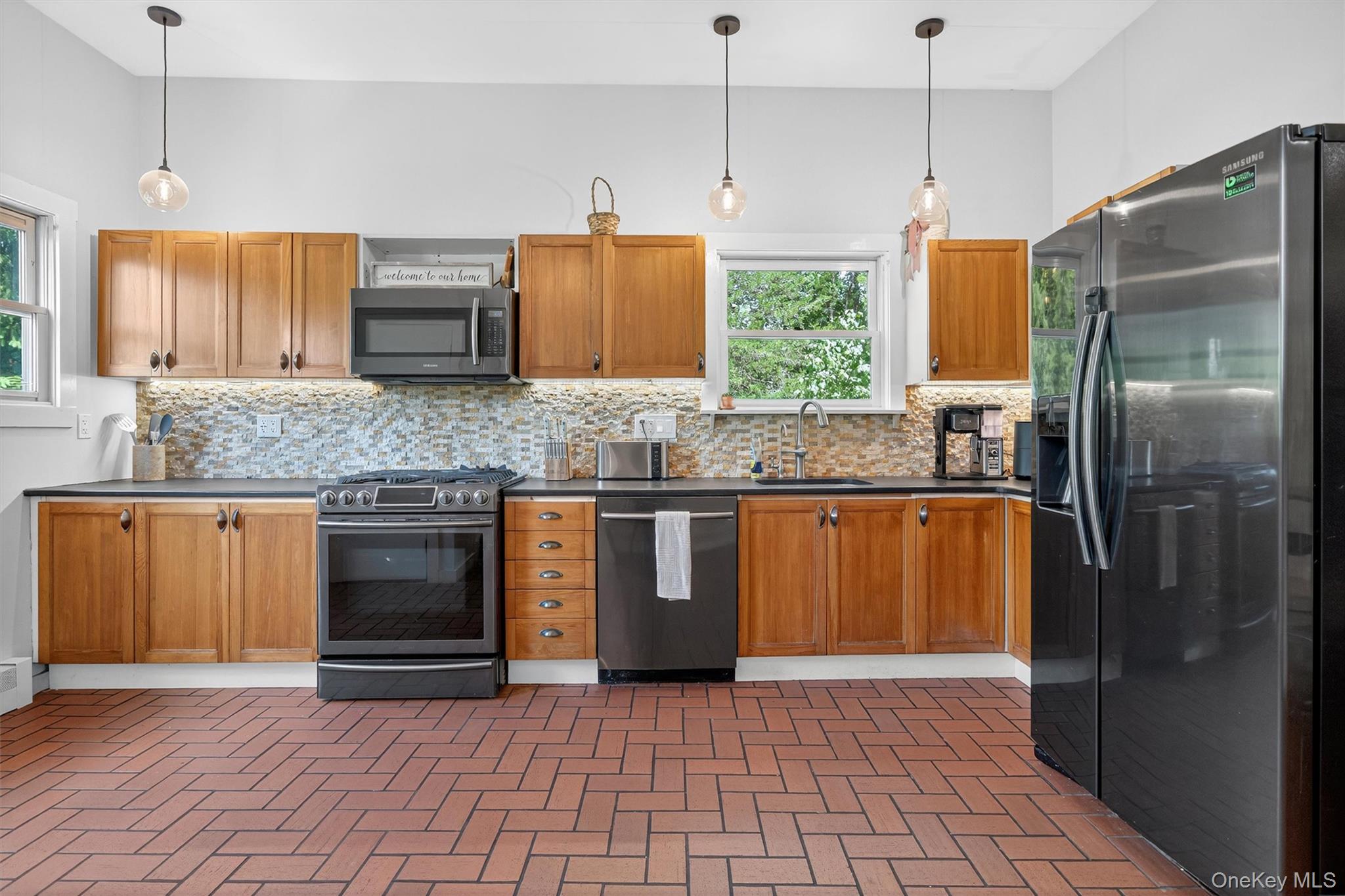 321 Bellvale Lakes Road Warwick, NY 10990 - Photo 10 of 33 a kitchen with stainless steel appliances granite countertop a refrigerator a stove a sink and dishwasher