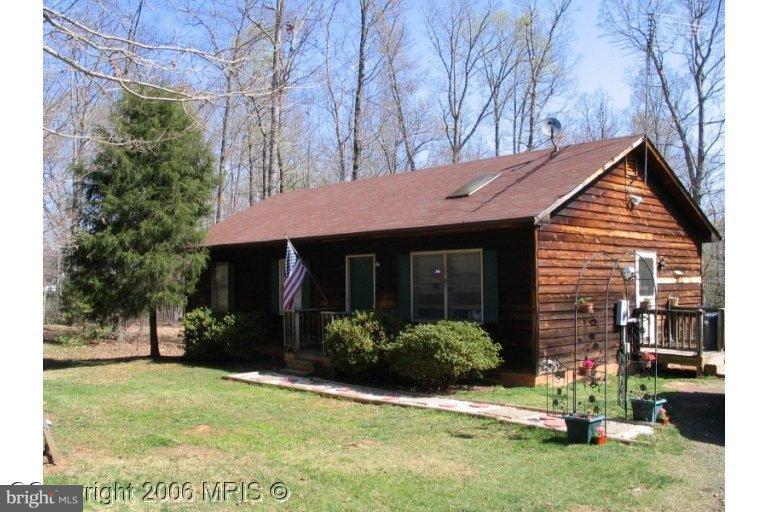 14331 Snake Castle Road Sumerduck, VA 22742 - Photo 3 of 11 a front view of a house with garden