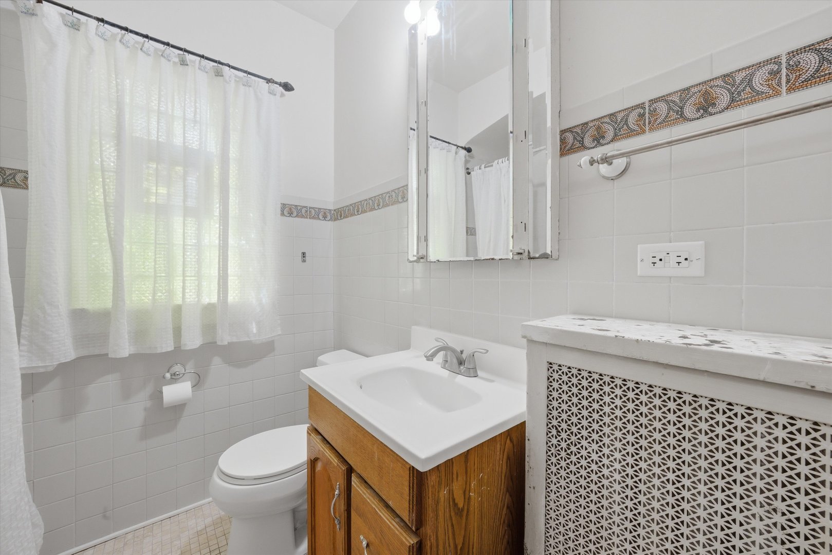3100 Clinton Avenue Berwyn, IL 60402 - Photo 11 of 25 a bathroom with a sink toilet and shower