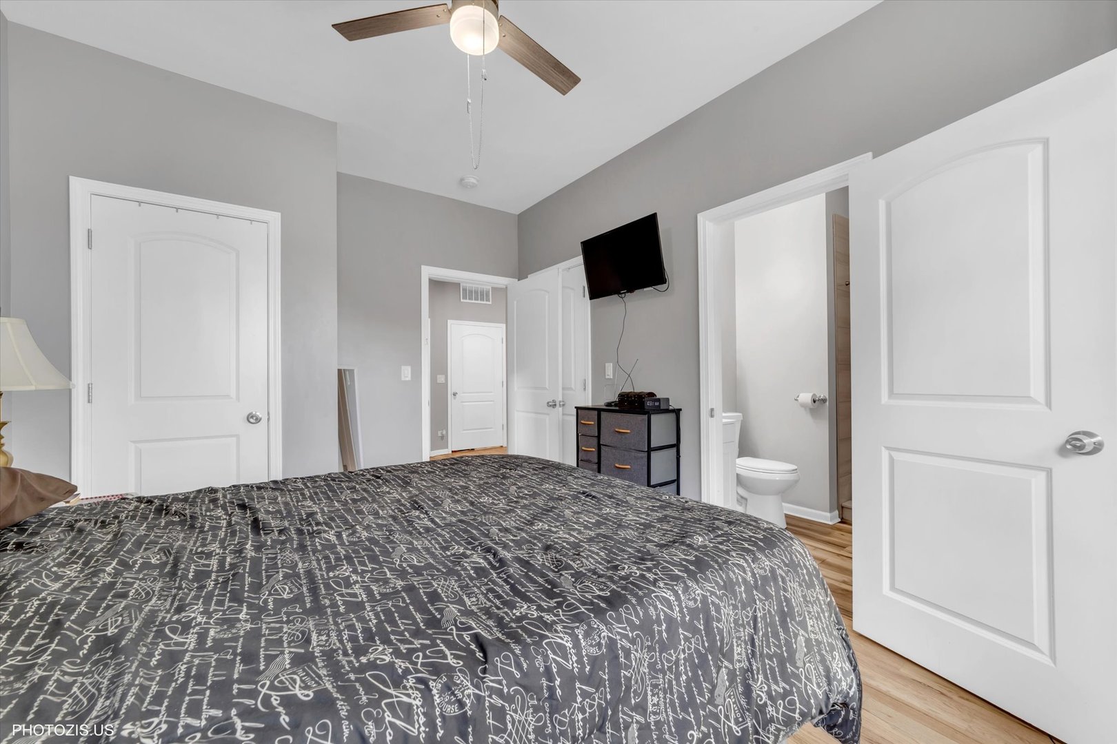 8404 South Exchange Avenue Chicago, IL 60617 - Photo 14 of 48 a bedroom with a bed and a view of bathroom