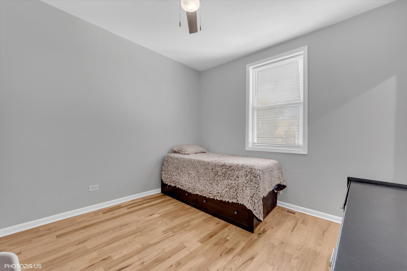 8404 South Exchange Avenue Chicago, IL 60617 - Photo 19 of 48 a bedroom with a bed and a window
