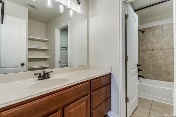 a bathroom with a sink and a bathtub