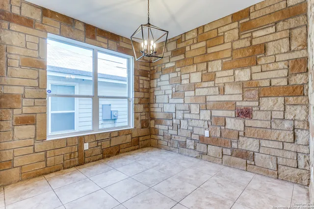 a view of an empty room and a window