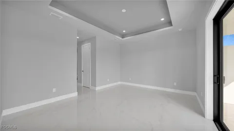 a kitchen with stainless steel appliances granite countertop a refrigerator and a stove