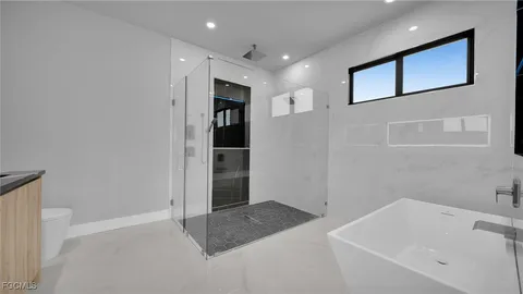 a kitchen with a sink and a toilet