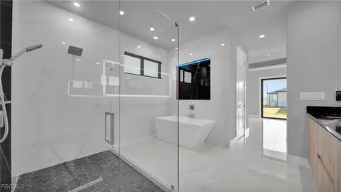 a bathroom with a sink a toilet and mirror