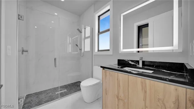 a bathroom with a shower and a sink