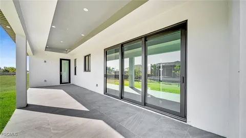 a view of a house with a back yard