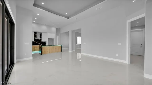 a view of a kitchen with white cabinets